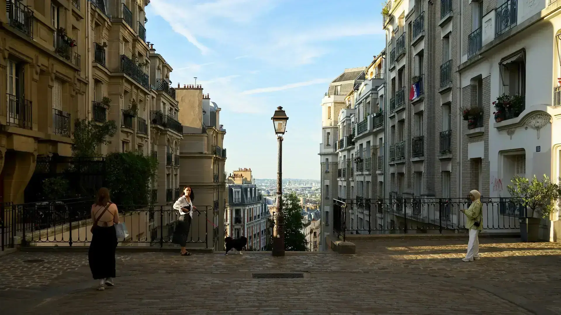 Walkers on a cobblestone street in Paris